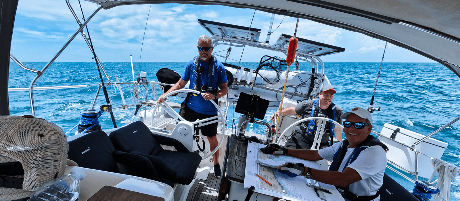 Ocean Sailing Adventures students practicing offshore navigation and helming aboard an Elan sailing yacht